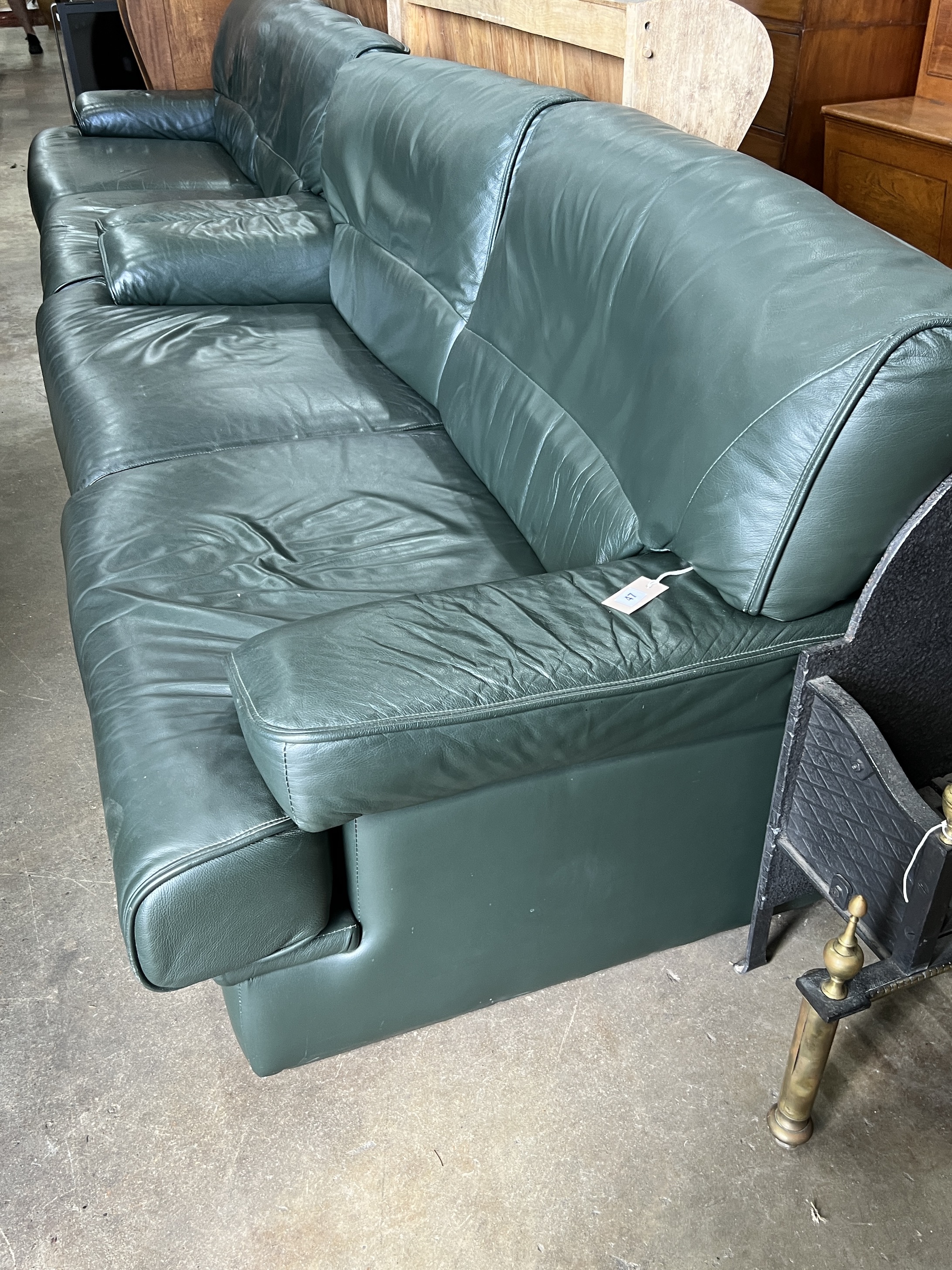 A pair of Army and Navy dark green leather upholstered settees, length 190cm, depth 80cm, height 84cm